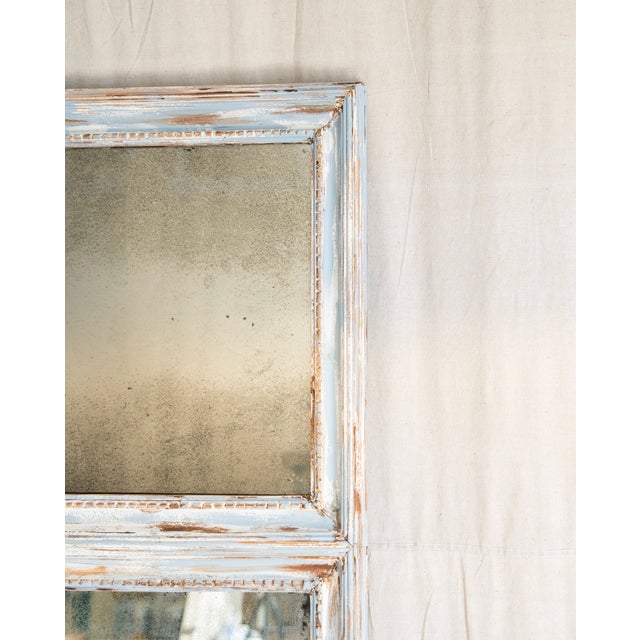 Antique Delphine Mirror showcases classic French charm with its distinctive tiered design. The piece features a mirrored...