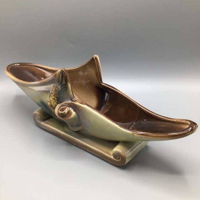 Ready for a table center piece you can decorated for the holidays . Hull parchment and pine planter/vase.