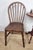 This is a beautiful kitchen chair, dating to the early 20th Century. It has many defining vintage features that are sure...
