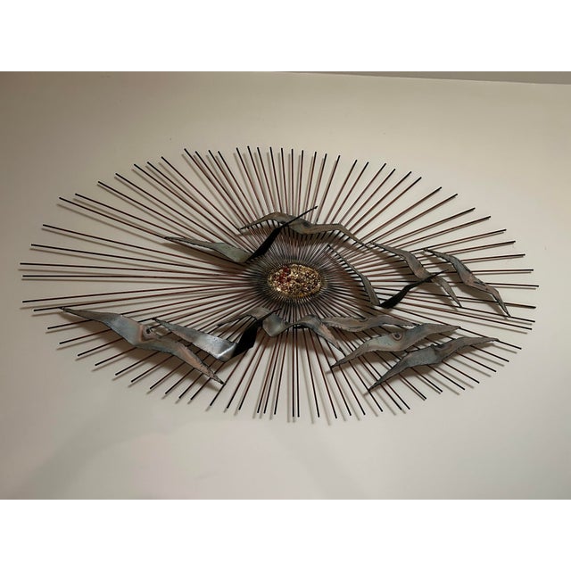 This is a vintage Curtis Jere-style "Sunburst with Birds" metal wall sculpture. The sculpture features a mid-century...