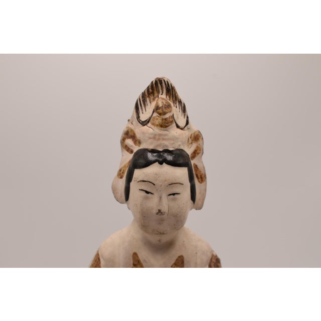 This is an antique Chinese Stoneware Figure. It likely represents Guanyin or a Daoist deity. We believe it is from during...