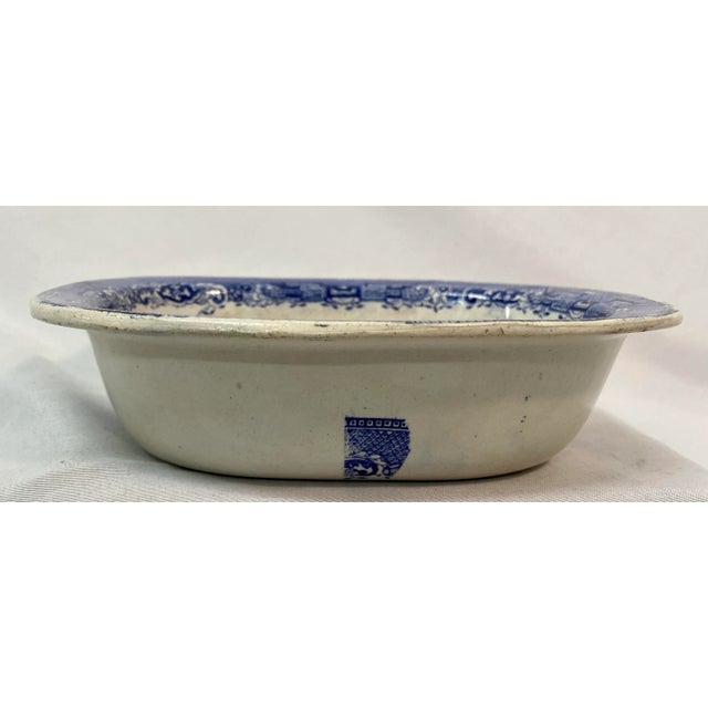 Antique Blue Willow Oval Bowl Made in England. Measures 71/4" X 5 3/4" X 2"