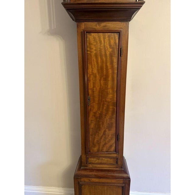 Quality antique George III mahogany and brass arched face long case clock, having a quality antique George III long case...