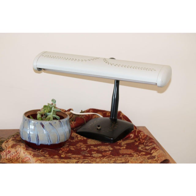 A unique desk lap done in the vintage tole style, hand painted decorations on both the top and the base. The gooseneck is...