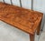 This is a 1970s Milo Baughman style burl olive wood Parsons style console table. The burl veneer highlights the wood grain...