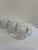 A set of six vintage Nestlé glass mugs dating to the 1970s. Each clear glass mug features an etched world map motif...