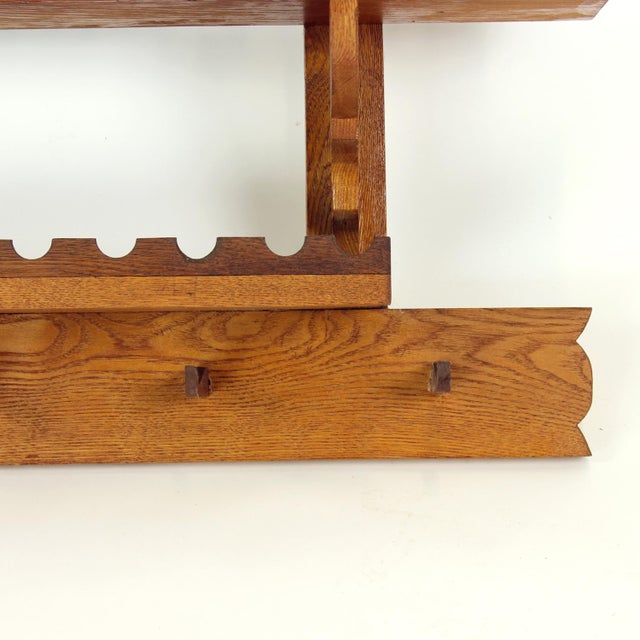 A beautifully crafted folk-style wooden wall shelf produced in Czechoslovakia in the 1950s. Made during a brief and...