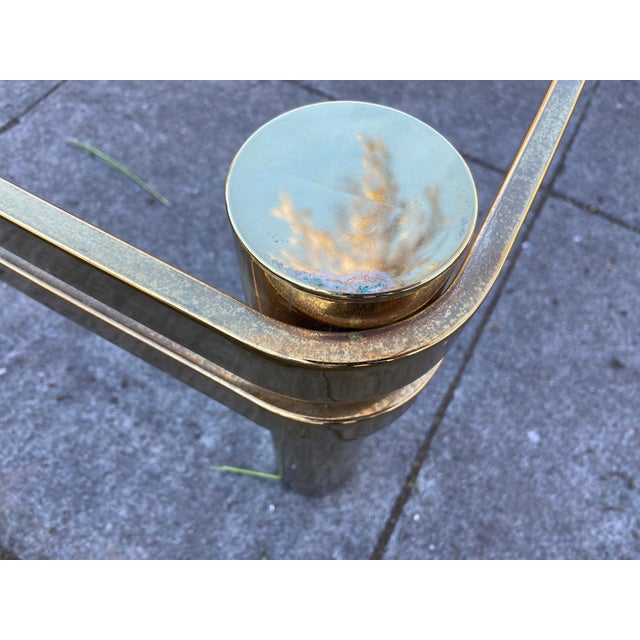 This Vintage Mid Century Modern Milo Baughman Style Brass & Glass Coffee Table exudes a classic Hollywood Regency style...
