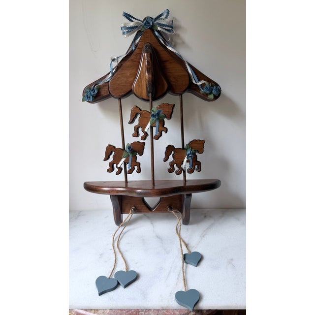 Wooden Wall Shelf a Vintage Carousel, Featuring a Canopy Top, Three Cut-Out Carousel Horses Blue Floral Ribbons, and Dangling Heart Accents. For Sale - Image 4 of 4