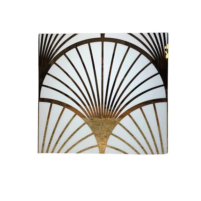 Modular panel in glass and brass. Also available in red and black.