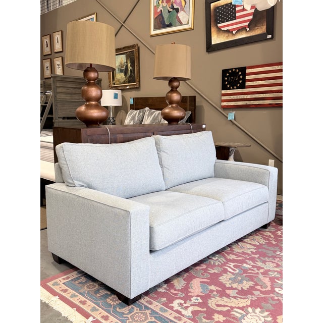 A well-proportioned sofa that brings together tailored structure and everyday comfort. The clean square arm profile and...