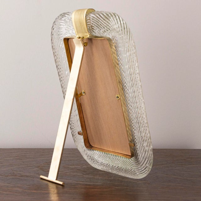 Collectable and unique murano glass photo frame handmade in the land of venice, italy. The twisted handmade glass is...