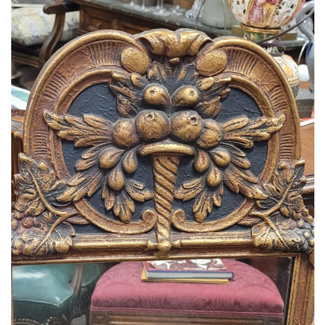 Find antique country French wood carved wall mirror. Measuring 39 in tall by 24 in wide and in fine condition. Features...