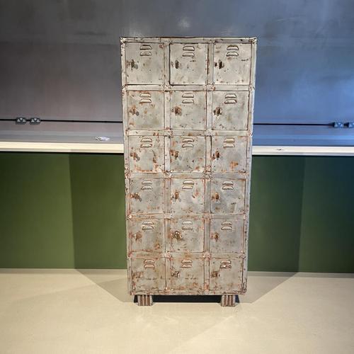 1930s 18-compartment metal locker which has been partly stripped and polished, with Art Deco feet. This stunning locker...