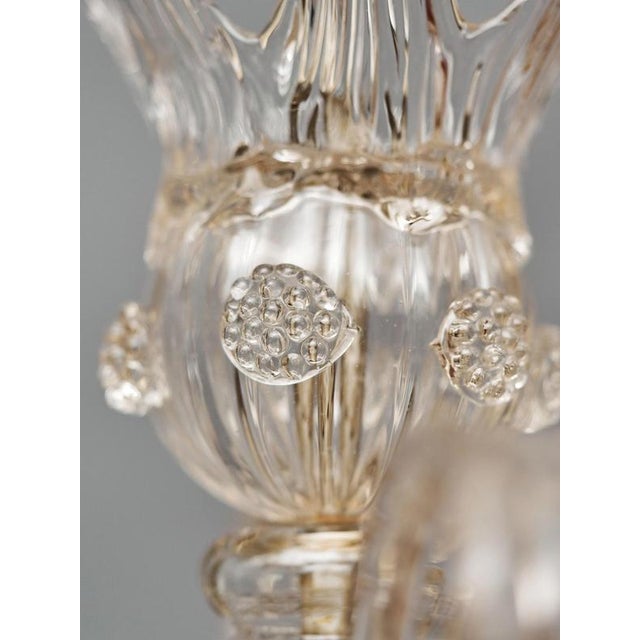 Elegant historical Venetian chandelier from the 1930s, made using the traditional technique of split (blown) glass. The...