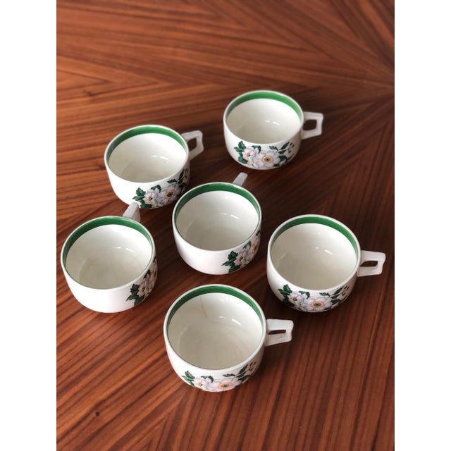 These delicate cups and saucers in the primrose pattern were created in the early half of the 1900s by National...