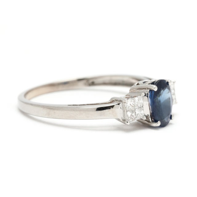 Stones: sapphire, 1 stone oval 7 x 5 mm approximately 1 total carat diamonds, 8 stones princess cut 1.6 - 1.75 mm...