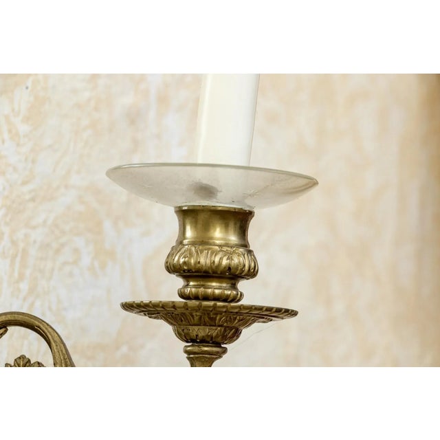 An absolutely stunning and quite rare pair of framed French or English Polished Brass Girandole Wall Mirrors in the Neo-...