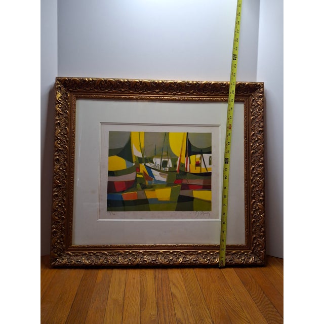 Featured is a vibrant limited edition color lithograph by the acclaimed French artist Marcel Mouly. Titled "Les...