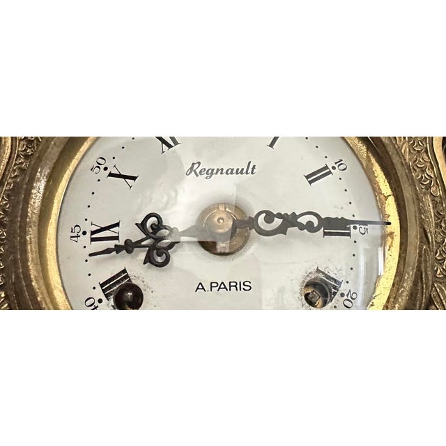 Signed "Regnault À Paris." Stamped "BREVETTATO" and "BREV." Paris, circa 1890–1900. Movement present, signed. A three-...