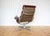 A gorgeous, iconic and rare 1970s tall back eames ‘soft pad’ swivel lounge chair in fair-to-good vintage condition....