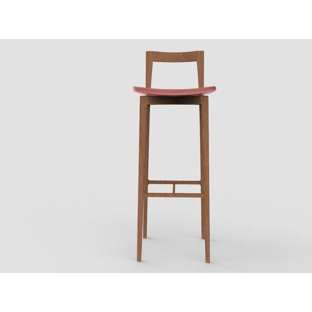 with its light and solid wood structure, this chair is suitable for contemporary interiors. Its proportions and reduced...