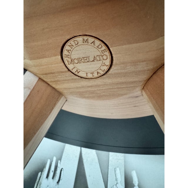 An exceptional example of contemporary Italian craftsmanship by Morelato. This Carambola side table is a sculptural study...