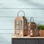 Elevate your home decor with this Natural Wooden Lantern with Glass Hurricane. Featuring a stunning combination of a...