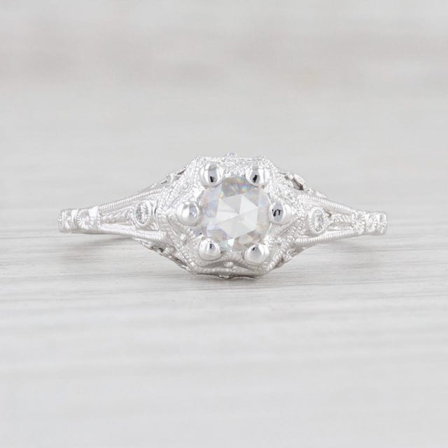 This lovely vintage style diamond ring is a Beverley K piece. Gem: Natural Diamonds - 0.19 Total Carats - Center - 0.17...