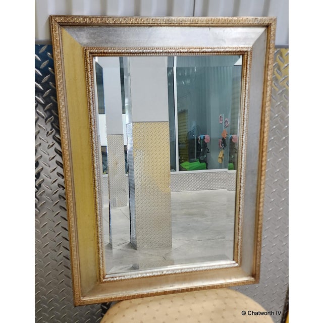 This is a very nice recently made silver-leaf and gilt hanging wall mirror with beveled glass. Approx 20 years old or so....