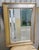 This is a very nice recently made silver-leaf and gilt hanging wall mirror with beveled glass. Approx 20 years old or so....