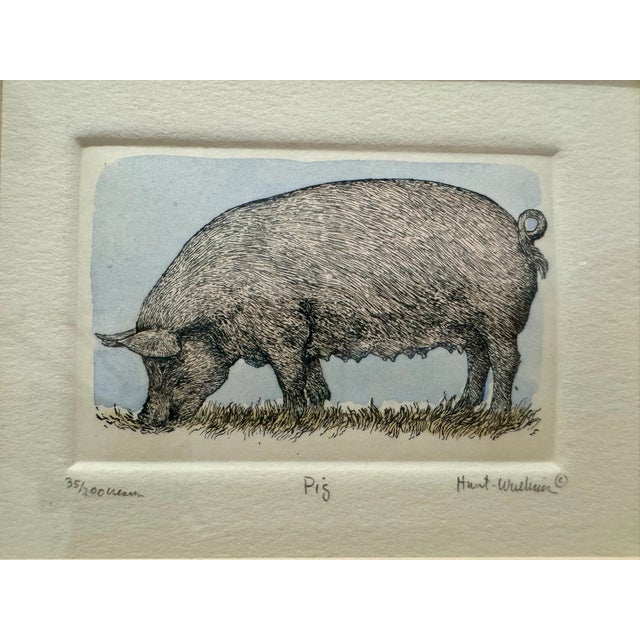 Signed and numbered limited edition etching titled “Pig” by Susan Hunt-Wulkowicz, edition 35/200. Hand-colored pig image...