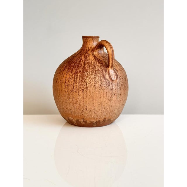 A hand-thrown, high-rise ceramic vase by Elke & Elmar Kubicek, characterized by the duo's clear, serene design language...