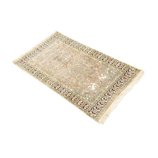 Cashmere Rug from the 1960s with a wonderful floral pattern. The silk allows for detailed patterns and gives the rug a...