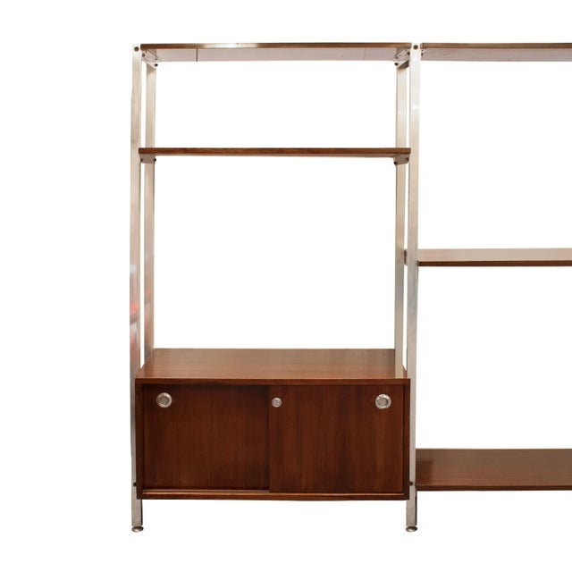 Office modular shelf edited by ICF Padova in the 1970s. Height adjustable steel structure, with mahogany shelves and two...