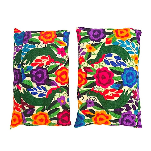 Offered are two vintage 1970s Otomi Tenango hand-embroidered textiles that have been hand-stitched into pillows. Both of...
