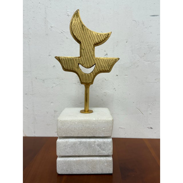 Design Plus Gallery presents a Polynesian Small Gold Leaf Symbol Sculpture from Global Views. This unique sculpture is...