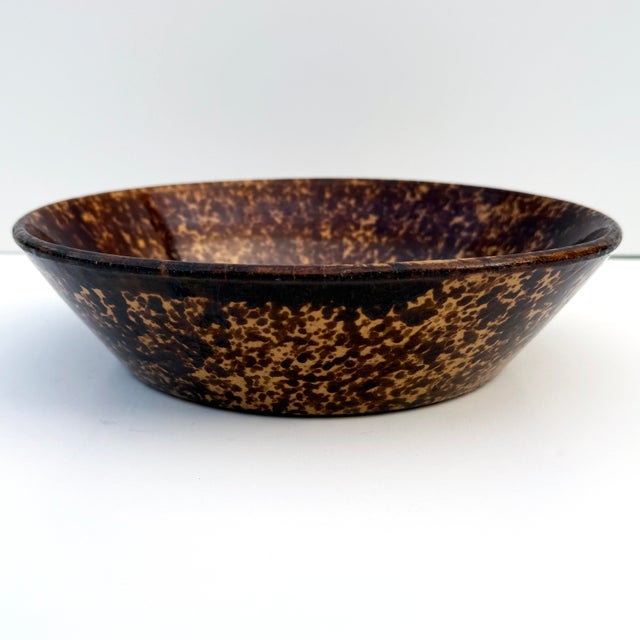 This antique spongeware serving bowl in a rich Rockingham glaze is a beautiful example of early American folk art pottery....