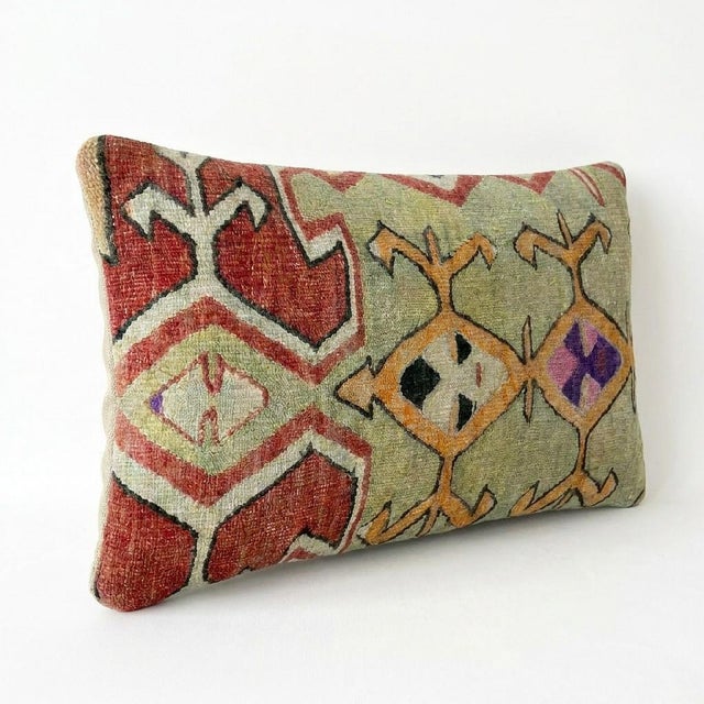 This beautiful 16'' x 24'' hand-woven Kilim pillow cover was made from an authentic Turkish kilim. The traditional flat-...