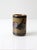 This mid-century Otagiri stoneware cup features a cylindrical form with a textured floral relief, finished in earthy red...