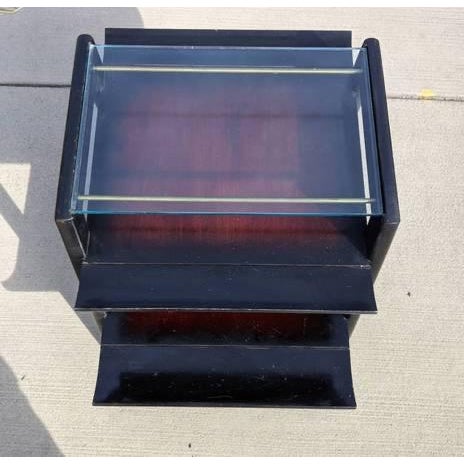 Mid Century Modern side/ occasional tables were realized in the United States circa 1950. Table feature compass style legs...