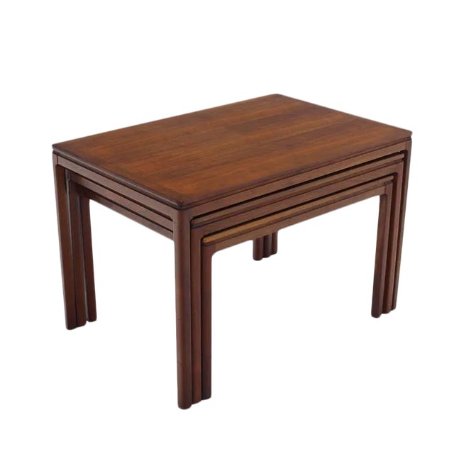 Set of three teak Mid-Century Danish modern nesting tables. Perfect for a modern home.