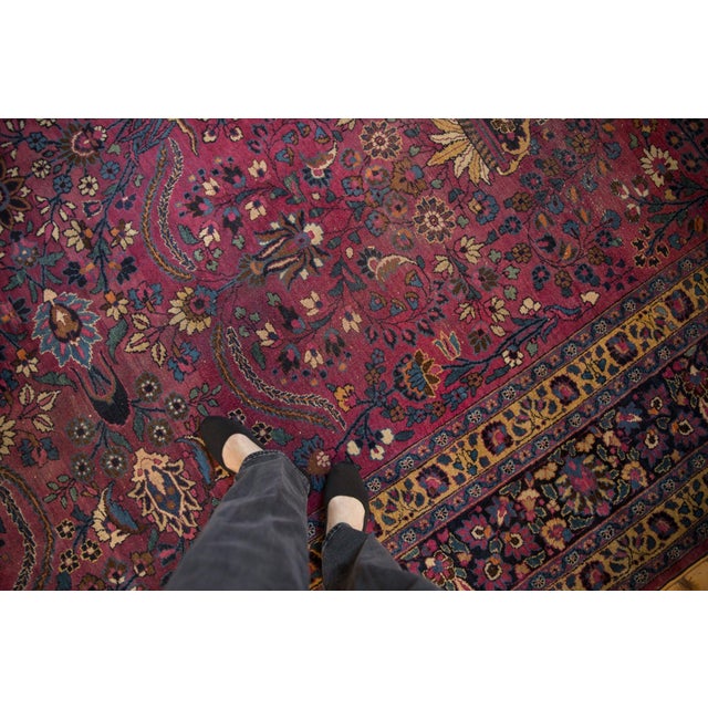 :: Highly unusual purple ground field with abrashes across covered in an allover delicately executed design elements of...