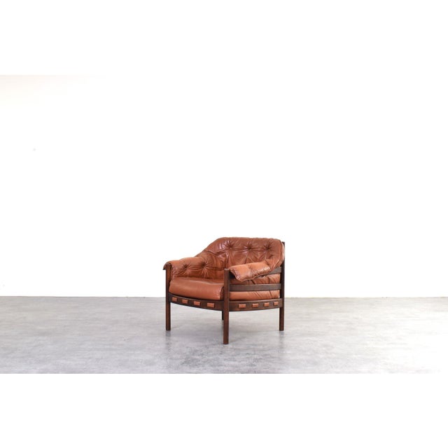 Designed by Arne Norell and manufactured by Coja in Sweden in the 1960s, this armchair is a prime example of Scandinavian...