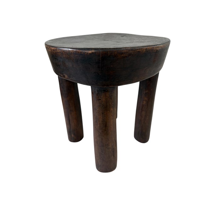 This stunning and rare vintage African wooden milk stool, skillfully crafted by the Hehe Gogo people in Tanzania from a...