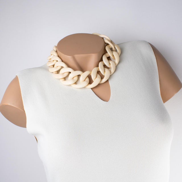 This stunning Angela Caputi, made-in-Italy, choker necklace features an extra-large flat resin chain design in creamy...