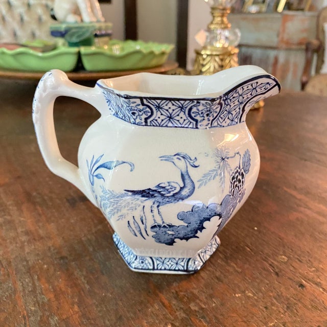 This is a vintage blue and white Earthenware creamer/milk jug in the "Yuan" pattern made by Wood & Sons (designed around...