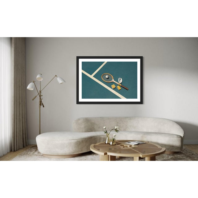 Elevate your space with this distinctive art piece featuring a vintage wood racket, white tennis ball, and vintage wrist...