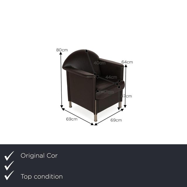 The Logo armchair from Cor is covered in brown genuine leather and stands on silver metal feet. It is characterized by its...
