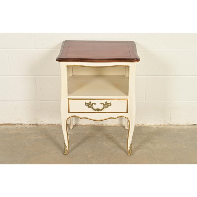 A gorgeous French Provincial Louis XV style nightstand or end table By Kindel Furniture USA, 1970s Carved solid cherry...